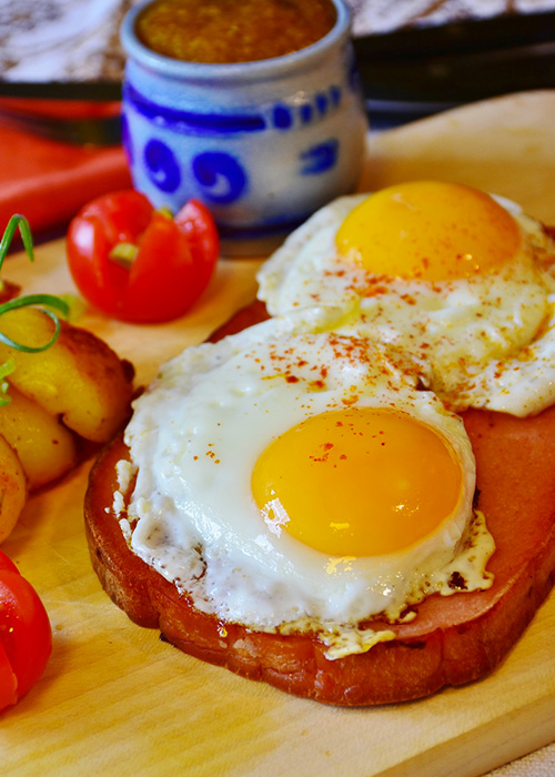 Breakfast plate with eggs and sides.